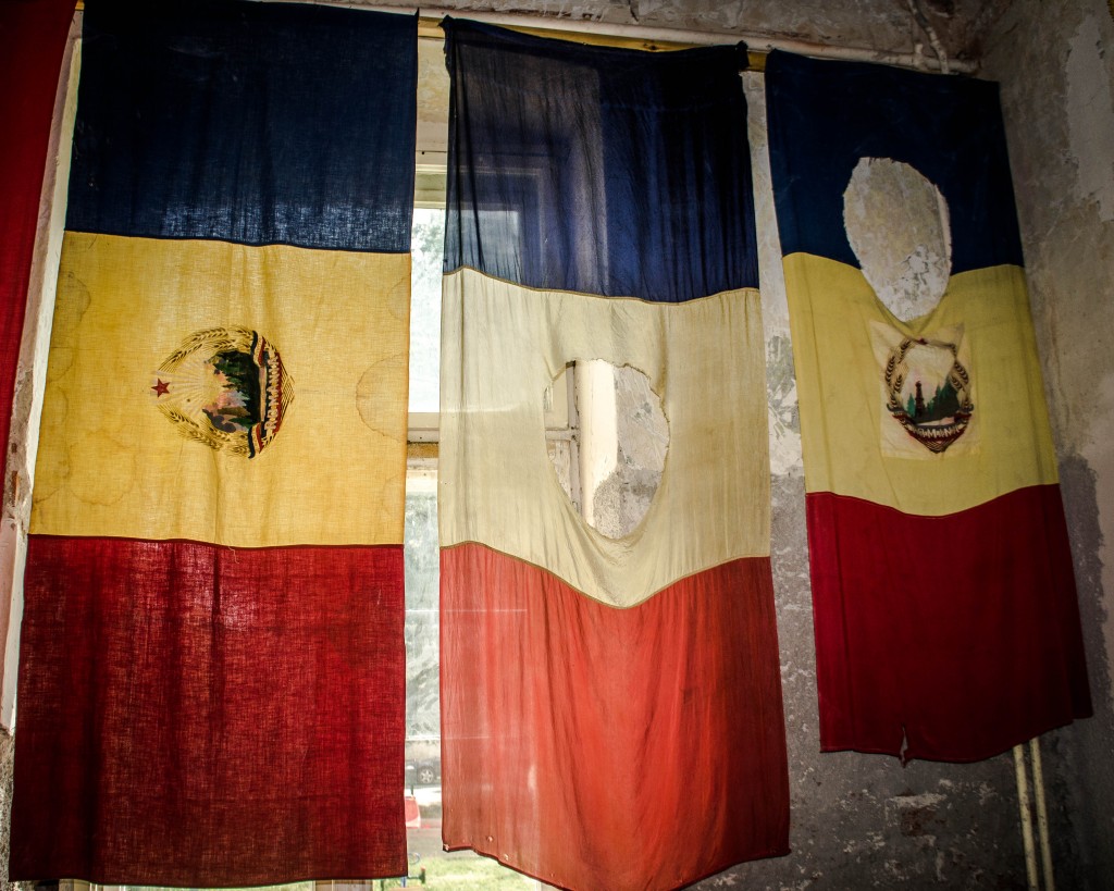 Flags of the Revolution on display in the museum. The communist crest has been removed from the centre.